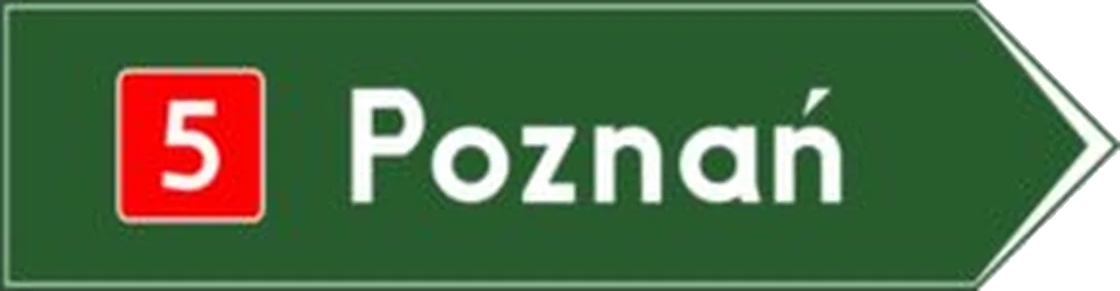 Drogowskaz w kształcie strzały do miejscowości ze wskazaniem numeru drogi