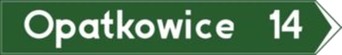 Drogowskaz w kształcie strzały do miejscowości podający odległość